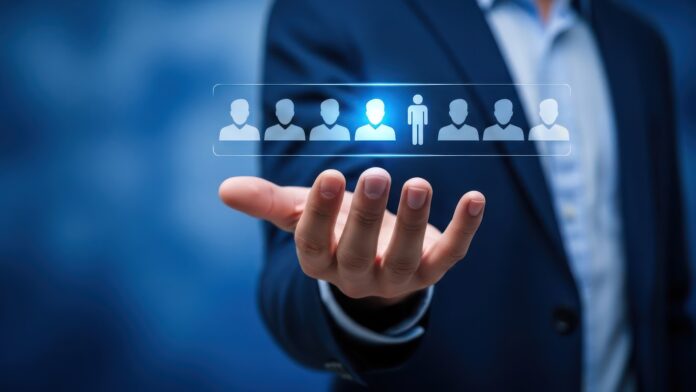 Leadership and team management, businessman presenting team members with a leader highlighted, copy space background